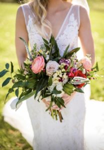 Bride holding gorgeous spring bridal bouquet