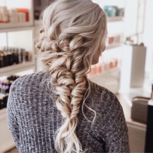Blonde girl. Thick, long hair. Large, braided bridal hairstyle