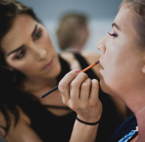 Nashville makeup artist Mandy Davis applying makeup to a bride.