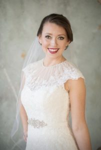 Portrait of a chic bride with updo, red lipstick